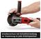 A hand is holding an angle grinder with a red handle. Text: 'Disc guard with quick adjustment for adaptation to any working position'.