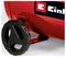 Close-up of a red machine with a black wheel or knob and a partially visible 'Einhell' logo on the side.