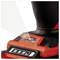 Close-up of a red and black electric tool with an LED display and a switch, likely part of a cordless drill.