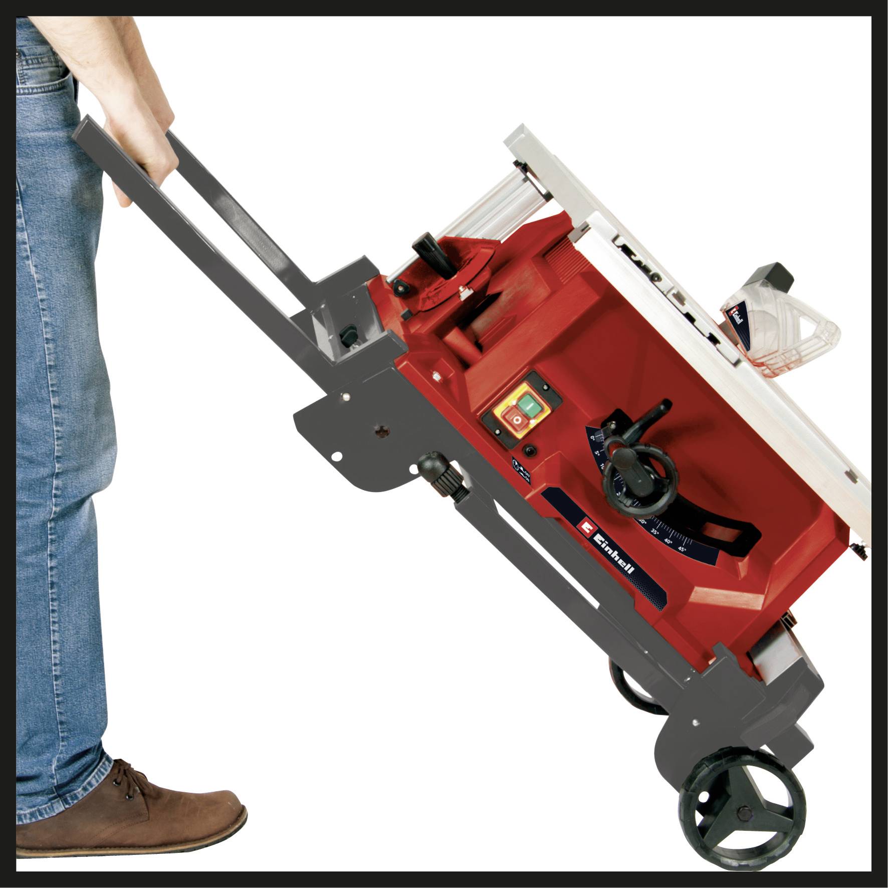 A person tilts and moves a red Kobalt table saw on wheels, using the handle for transportation. The saw is displayed from a side view.