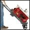 A person tilts and moves a red Kobalt table saw on wheels, using the handle for transportation. The saw is displayed from a side view.
