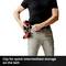 A man secures a drill to a belt clip at his hip. Text: 'Clip for quick temporary storage on the belt'.