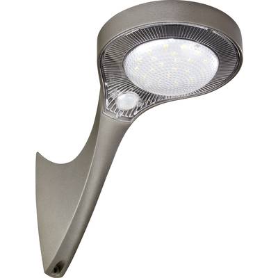 Modern metal outdoor wall light with rounded design. Integrated LEDs and motion sensor. Ideal for garden or courtyard lighting.