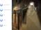 Outdoor area at night with illuminated wall lamp with motion sensor. Left technical details: Sensor range 120°, distance 3m, IP65, 21 LEDs, 1000 lumens.