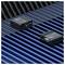 Two compact black electronic modules labeled 'TBS 1-4' and 'TBS 1-2' are shown on a blue-and-black striped surface.