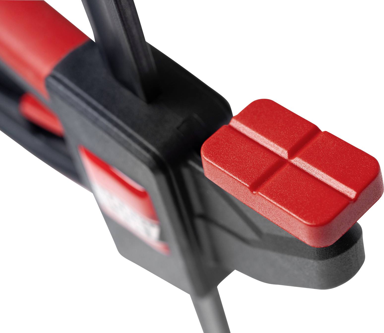 Close-up of a red G-clamp on a white background. The clamp is open, ready to secure materials.