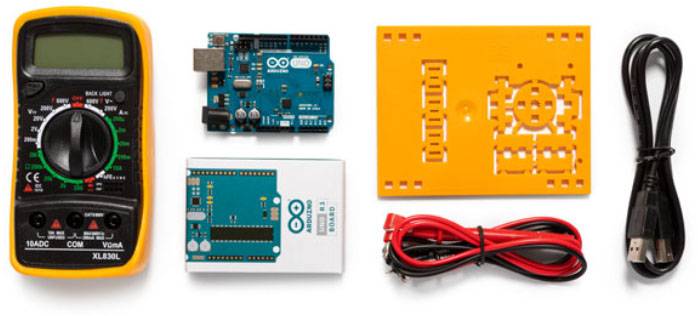 'Kit with multimeter, Arduino board, cables and enclosure for electronics projects.'