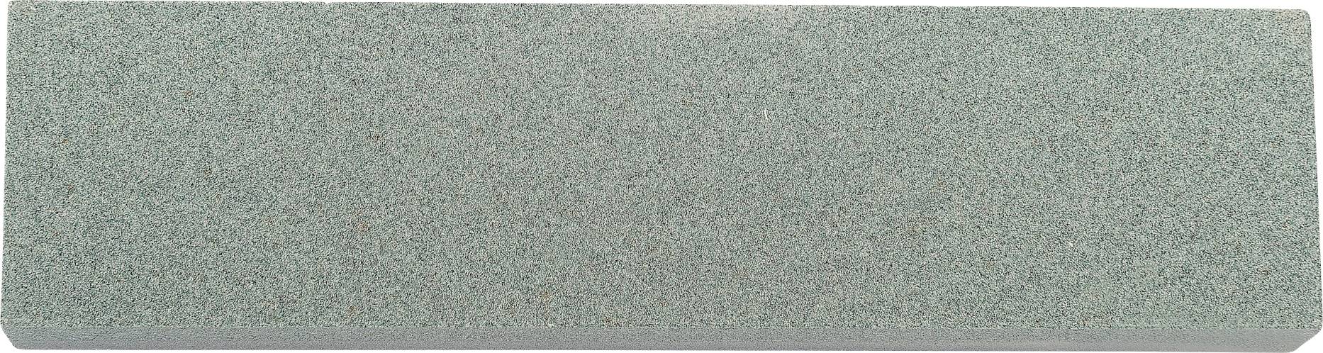 A rectangular green whetstone with a smooth surface, used for sharpening tools.