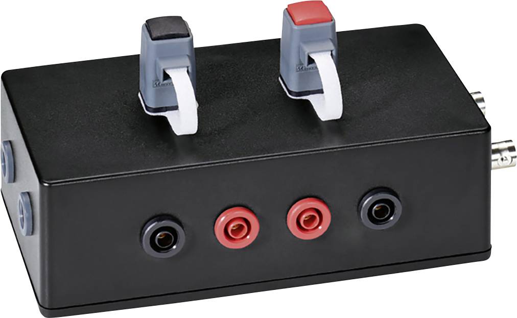 A black electronic box with multiple ports and two toggle switches on top, which are used for electronic connections.