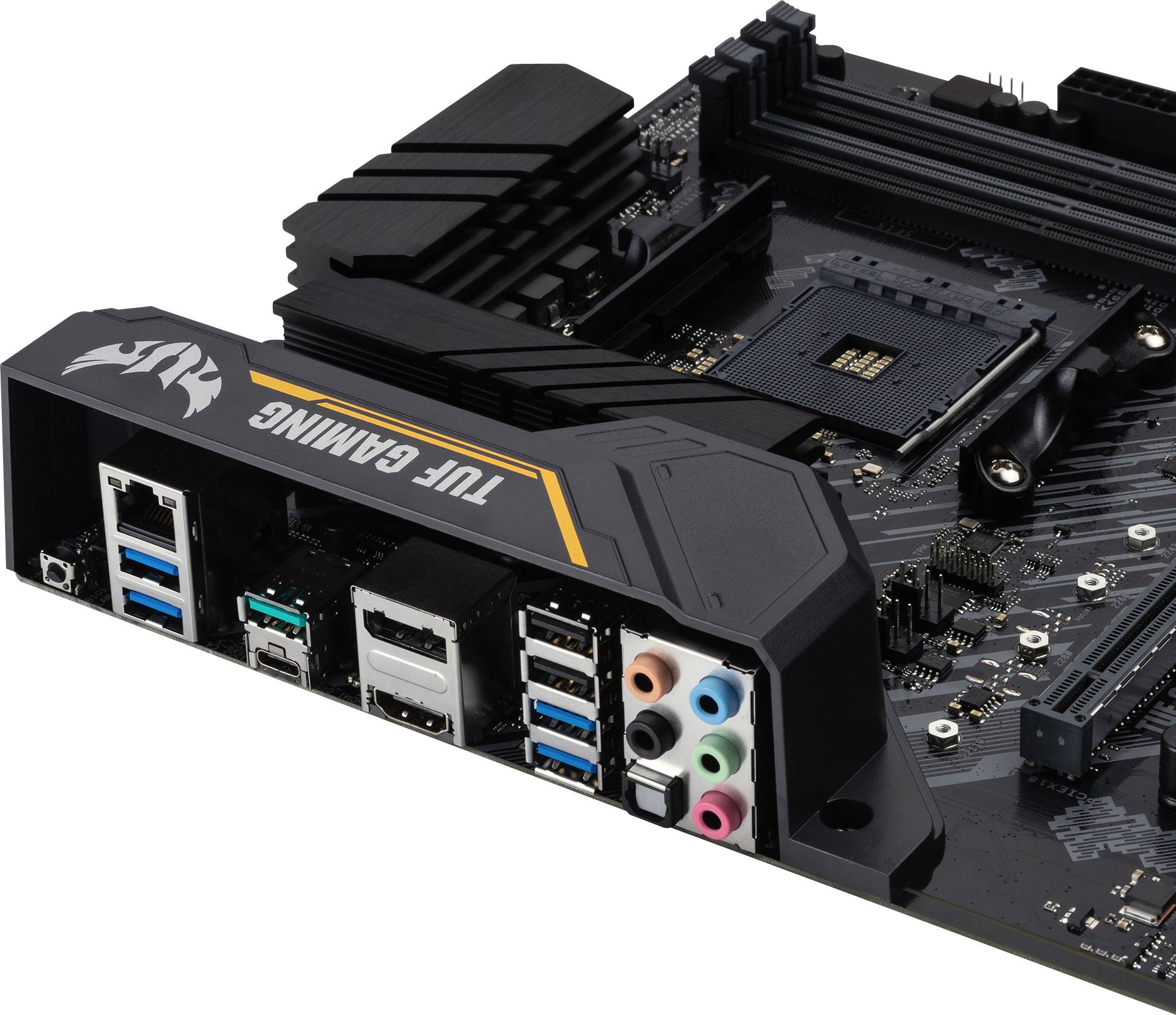 Motherboard of a computer with multiple USB ports, audio ports, and an Ethernet port. Marked with 'TUF Gaming'.
