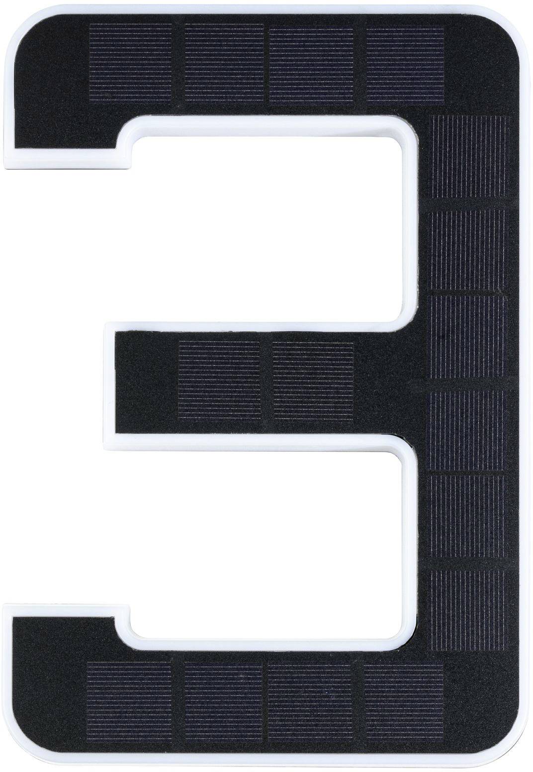 The image depicts the numeral '3', crafted from solar cells on a black surface.