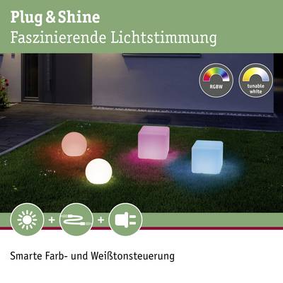 Plug & Shine Light Cubes in various colours and white tones on grass. Text: 'Plug & Shine - Captivating Lighting Atmosphere.'