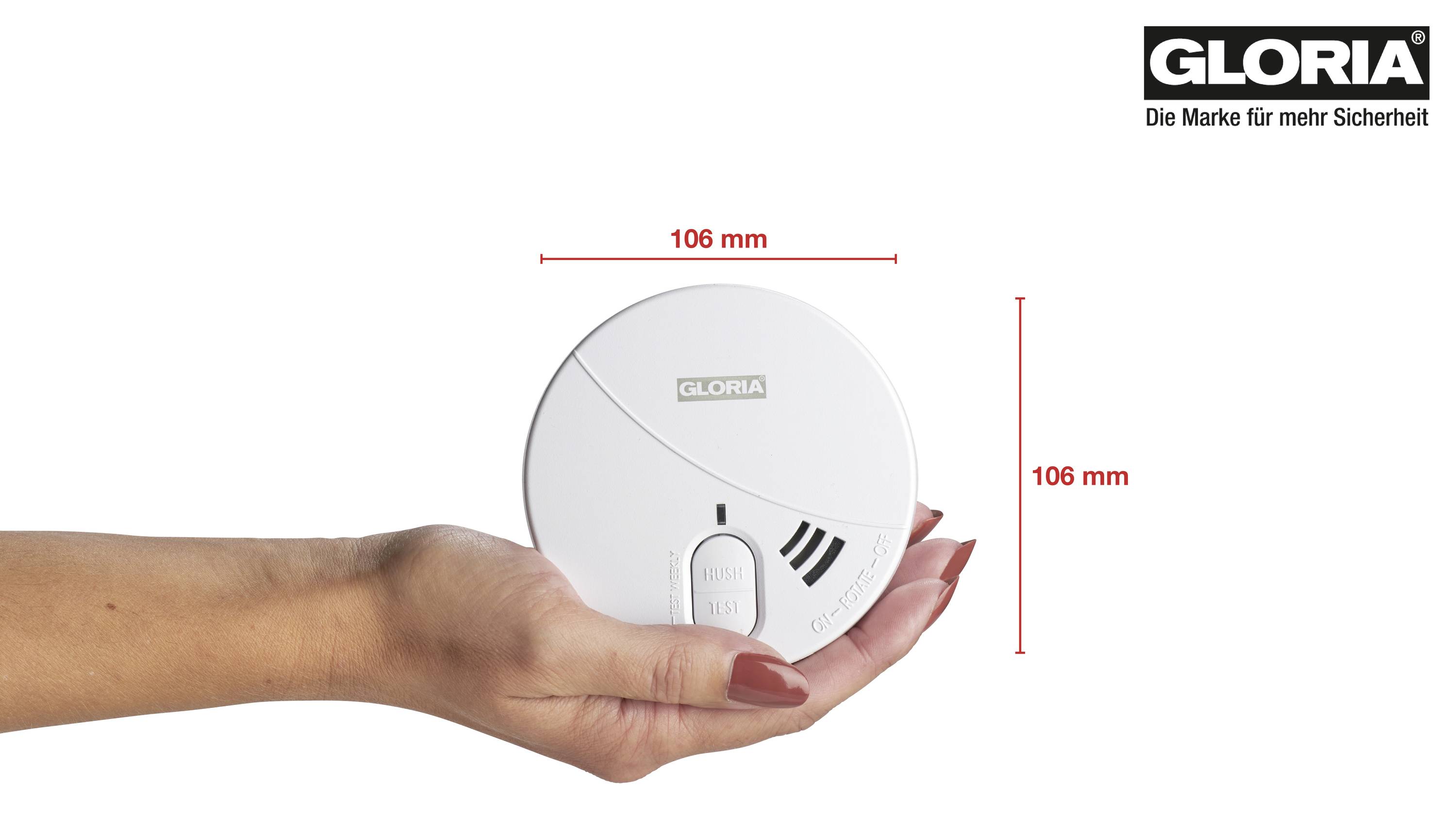 A hand is holding a round smoke detector with a diameter of 106 mm. In the top right, it reads 'GLORIA - The Brand for More Safety'.