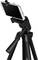 Smartphone mounted on a tripod, positioned for photo or video recording. The black tripod legs are stable and extendable.