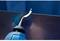 A hand deburring plier smooths the edge of a metal sheet. The main action is the removal of sharp edges.