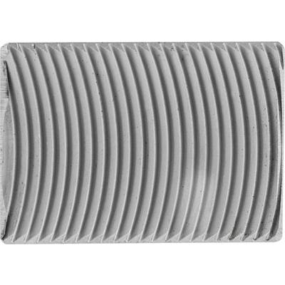 Close-up of a rectangular metal object with uniform, parallel grooves forming a wavelike structure.