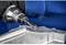 A milling machine is machining a piece of metal. The rotating cutting edge precisely removes material to shape the surface.