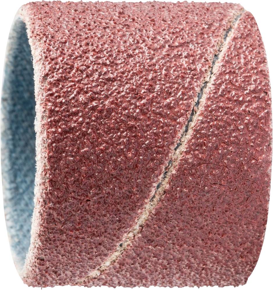 A coarse-grained red abrasive sanding belt roll, primarily used for metalworking, stands upright, close-up.