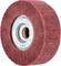Rust-brown grinding wheel with metal core, labelled with 'POLINOX Grinding Wheel' and technical specifications on the label.