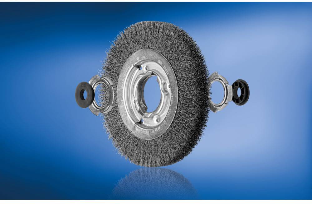 'Round brush with metal bristles against a blue background.'