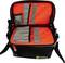 Opened black tool bag with red inner lining and grey tool holders, with shoulder strap.