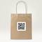 A brown paper bag with a large QR code on the front, inviting scanning.