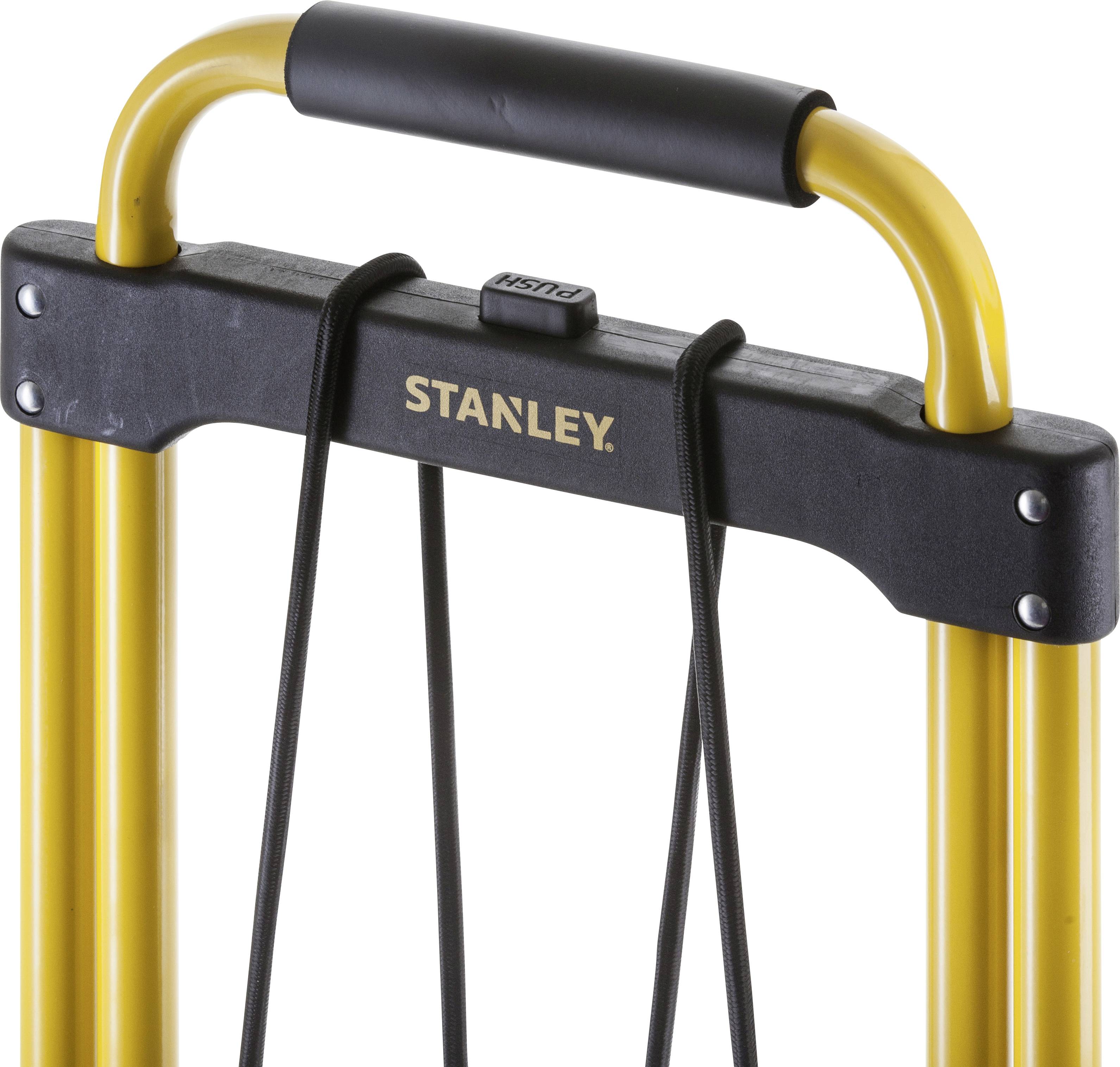 Handle of a yellow transport trolley with a black grip and the 'Stanley' imprint.