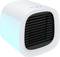 Small, white cube-shaped air cooler with a black ventilation grille and blue side panels, suitable for personal cooling.