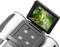 Digital camera with a flip-out screen displaying a green parrot perched on a branch. Technical controls are visible.