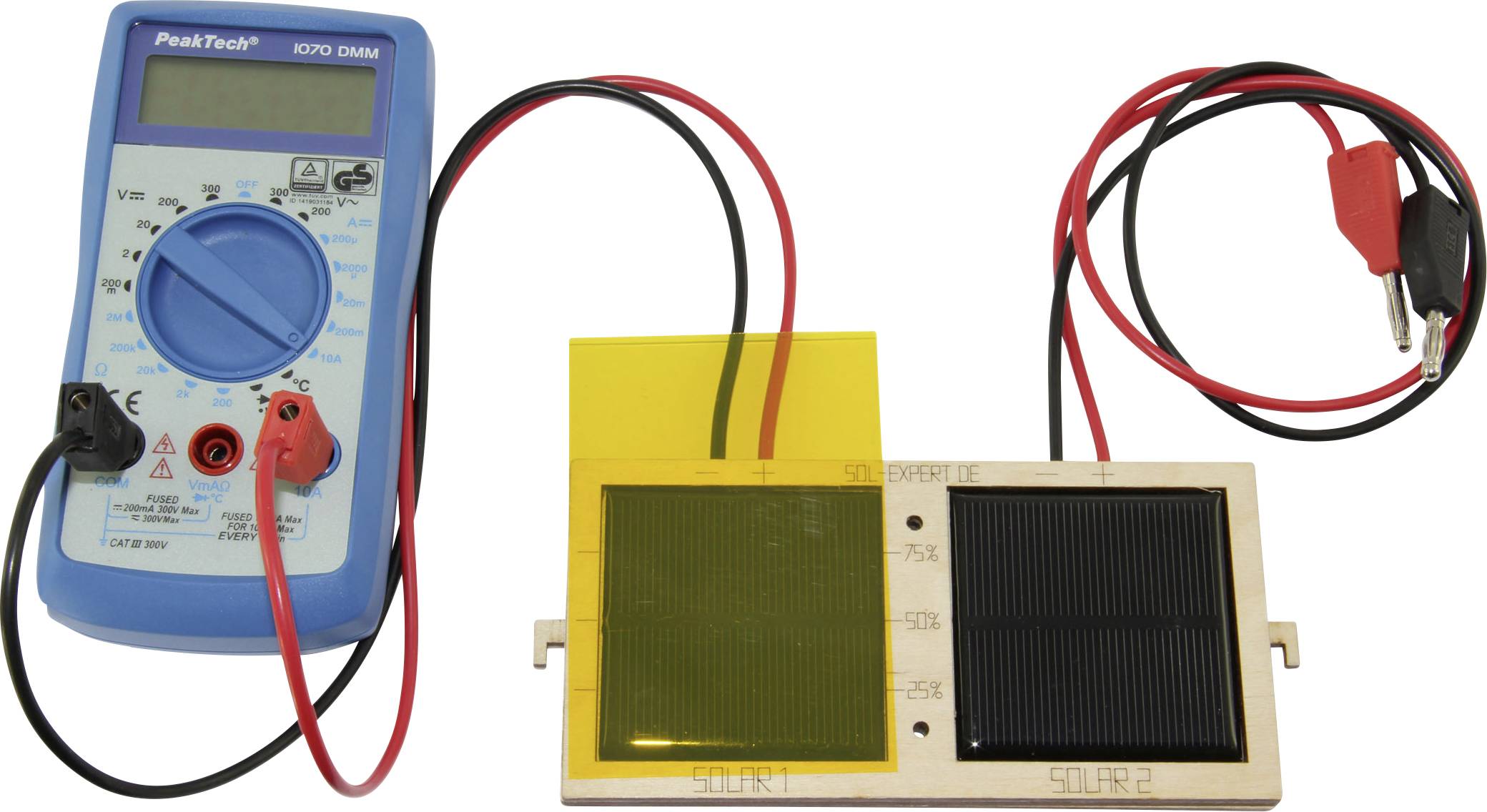 A multimeter is connected to two different solar panels, illustrating the comparison of electrical efficiency.