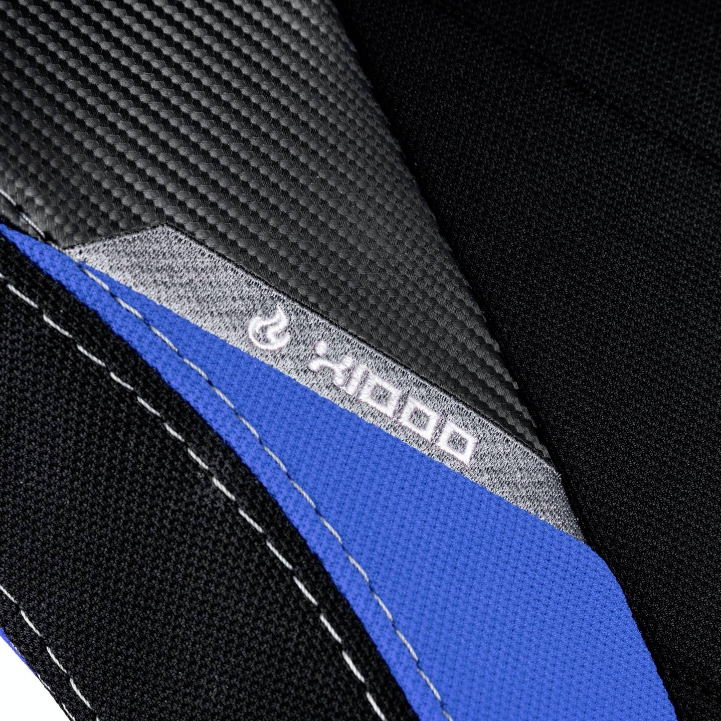Black and grey material with blue stitching and a small flame symbol. The text 'x1000' is visible near the symbol.