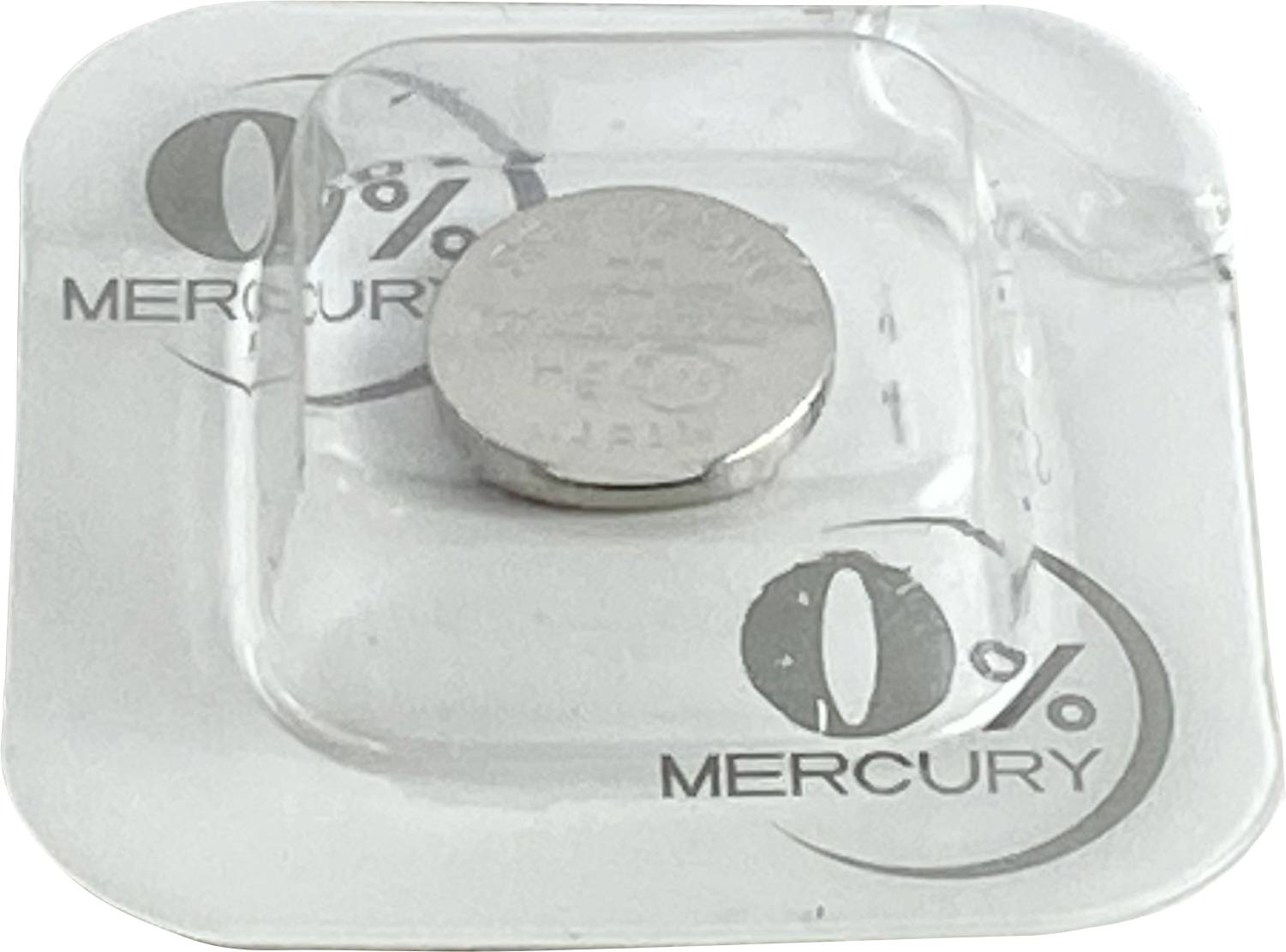 Round button cell in transparent packaging, printed with '0% Mercury', indicates mercury-free battery.