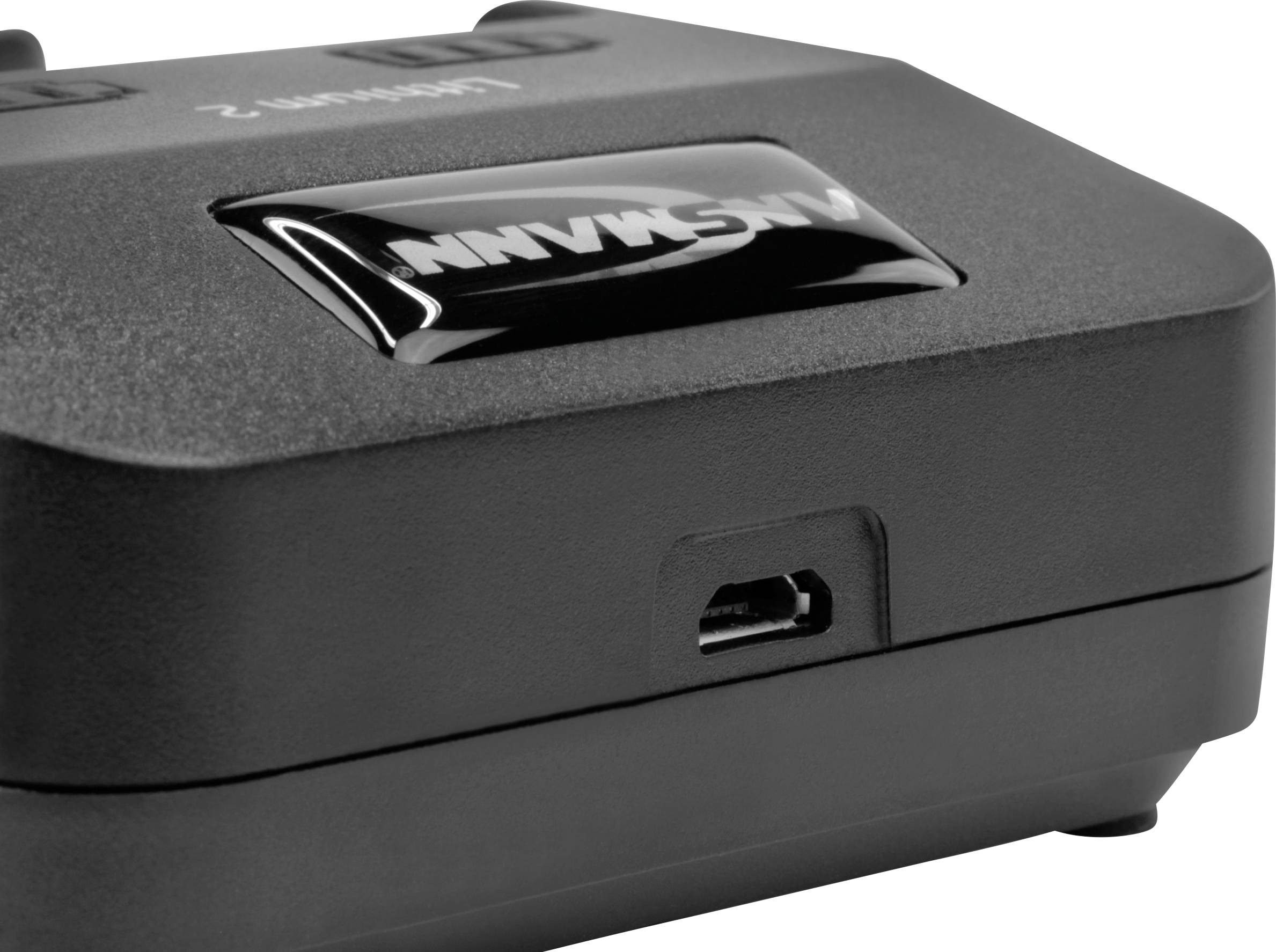 A black electronic device with a USB port. The device bears the inscription 'Axxonn'.