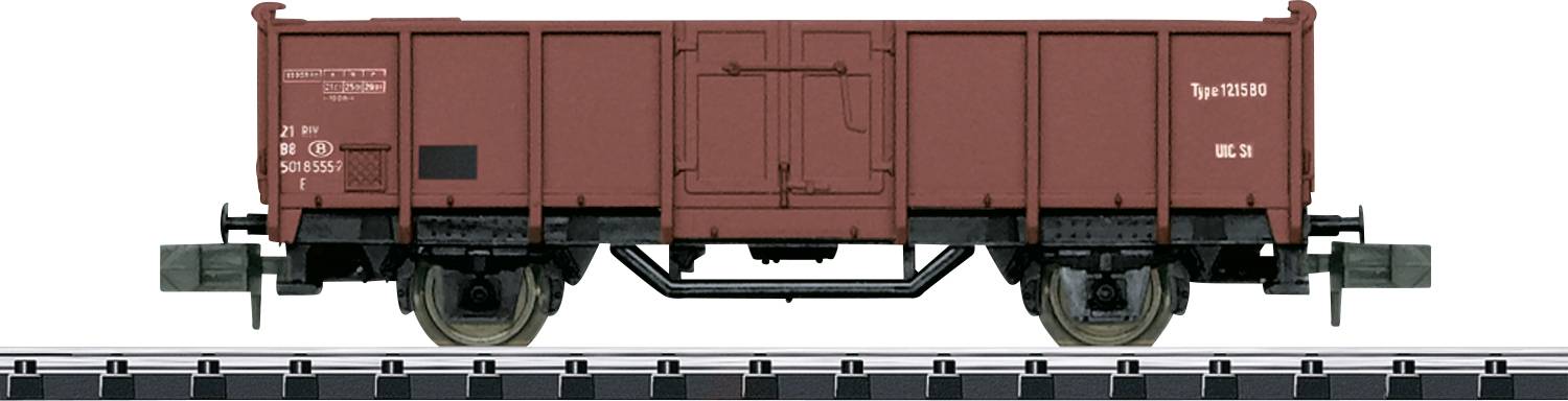 A brown goods wagon is standing on a railway track. The wagon is robust and suitable for transporting goods.