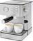 Stainless steel espresso machine with two espresso cups underneath, a pressure gauge on the left, a rotary knob on the right, and a cup warmer on top.