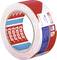 A red and white hazard tape by Tesa, used for safety and demarcation purposes.