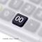 Double zero key on a keyboard, highlighted against a blurred background.