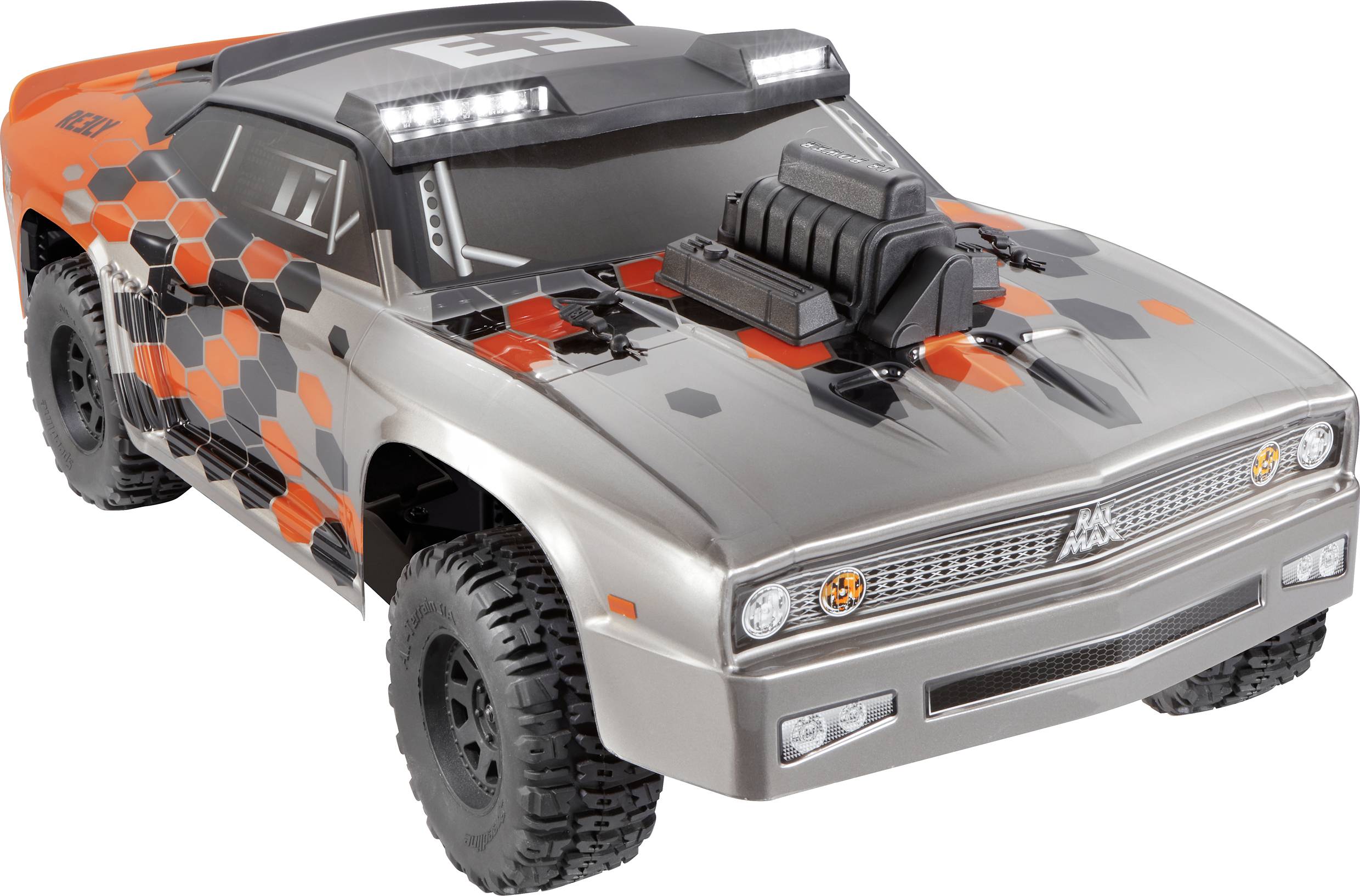 Remote-controlled car with grey and orange hexagonal design, large tyres, and a prominent air intake on the bonnet.