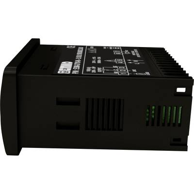 The image depicts a black electronic device with various switches and displays on its top surface, lying on its side.