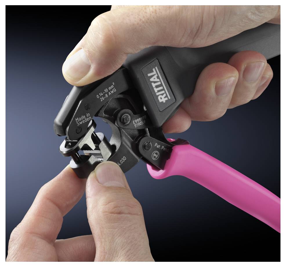 A hand holds a crimping tool from RITTAL, while the other inserts a cable. Tool and brand usage, focus on precision.