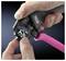 A hand holds a crimping tool from RITTAL, while the other inserts a cable. Tool and brand usage, focus on precision.