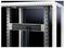 Metal frame with cables routed through a black cable trunking. Background dark grey.