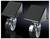 Two heavy black bike rollers with a robust metal construction and grey wheels, depicted against a black background.