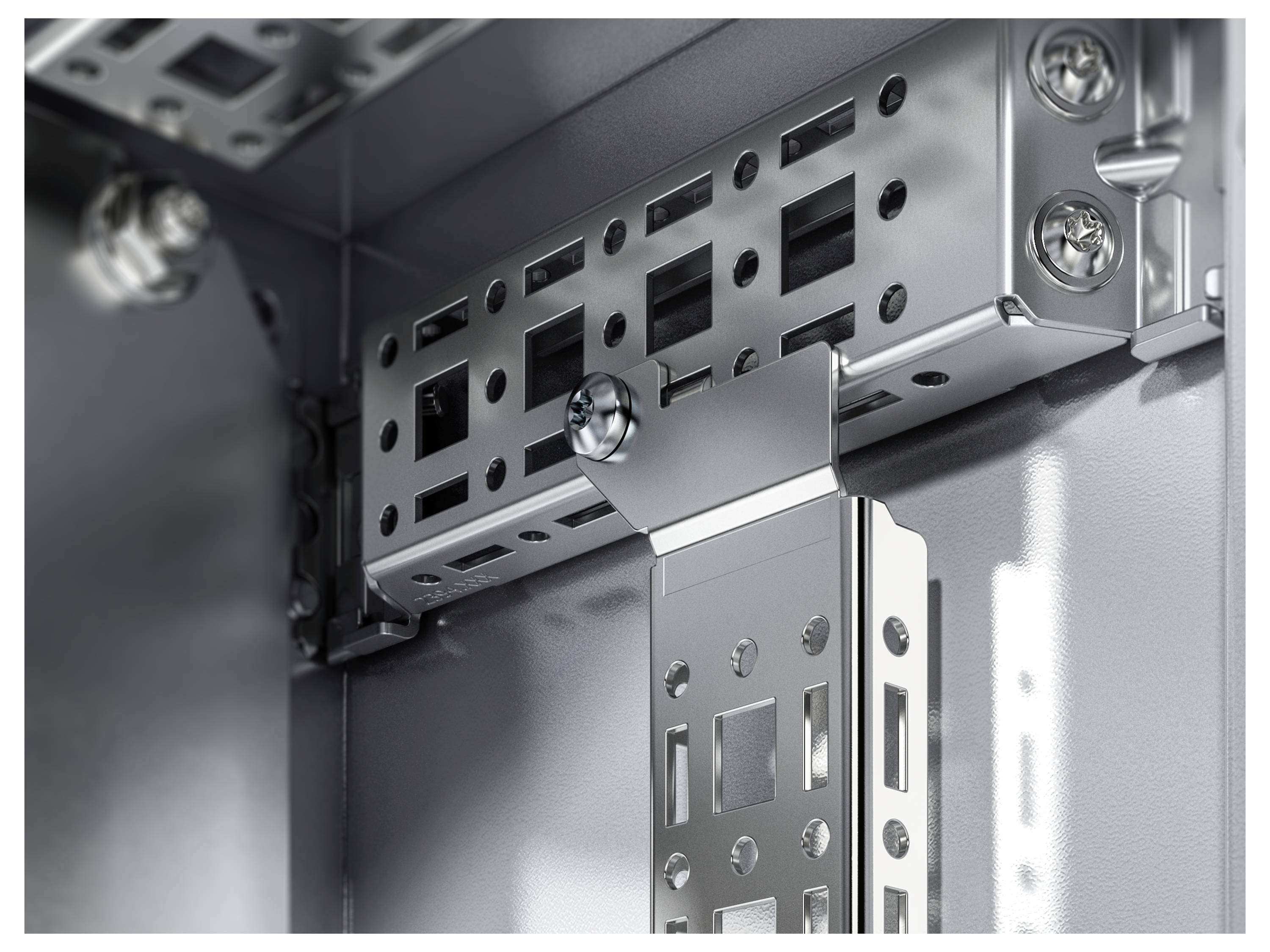 Close-up of a metal frame with screws and recesses in an enclosure, showing the structure and mounting elements.