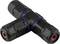 Black T-shaped plastic quick connector with blue rings and red valves, suitable for piping systems and cabling.