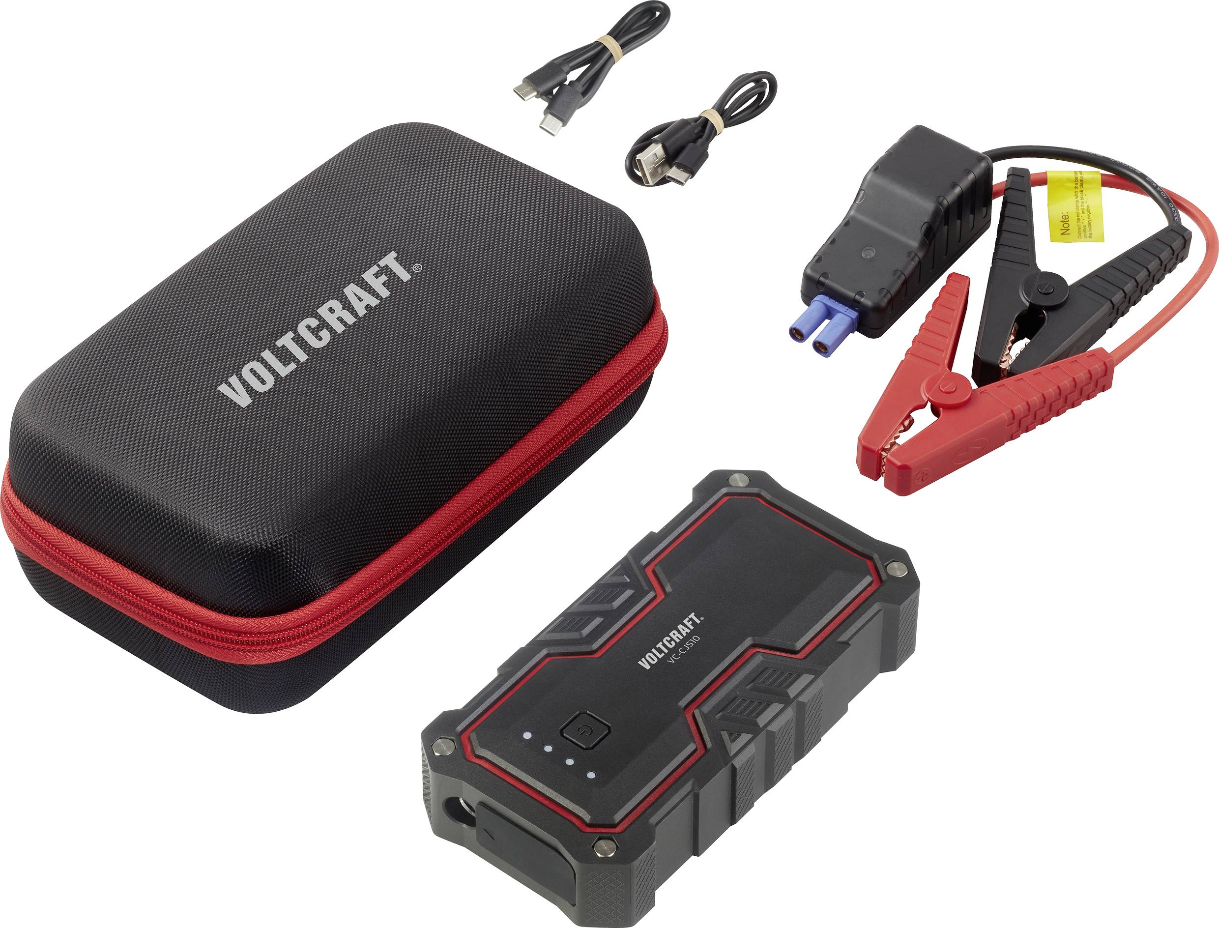Portable jump starter with cable, clamps and case. Main device is black and red with battery level indicator; Voltcraft logo visible.