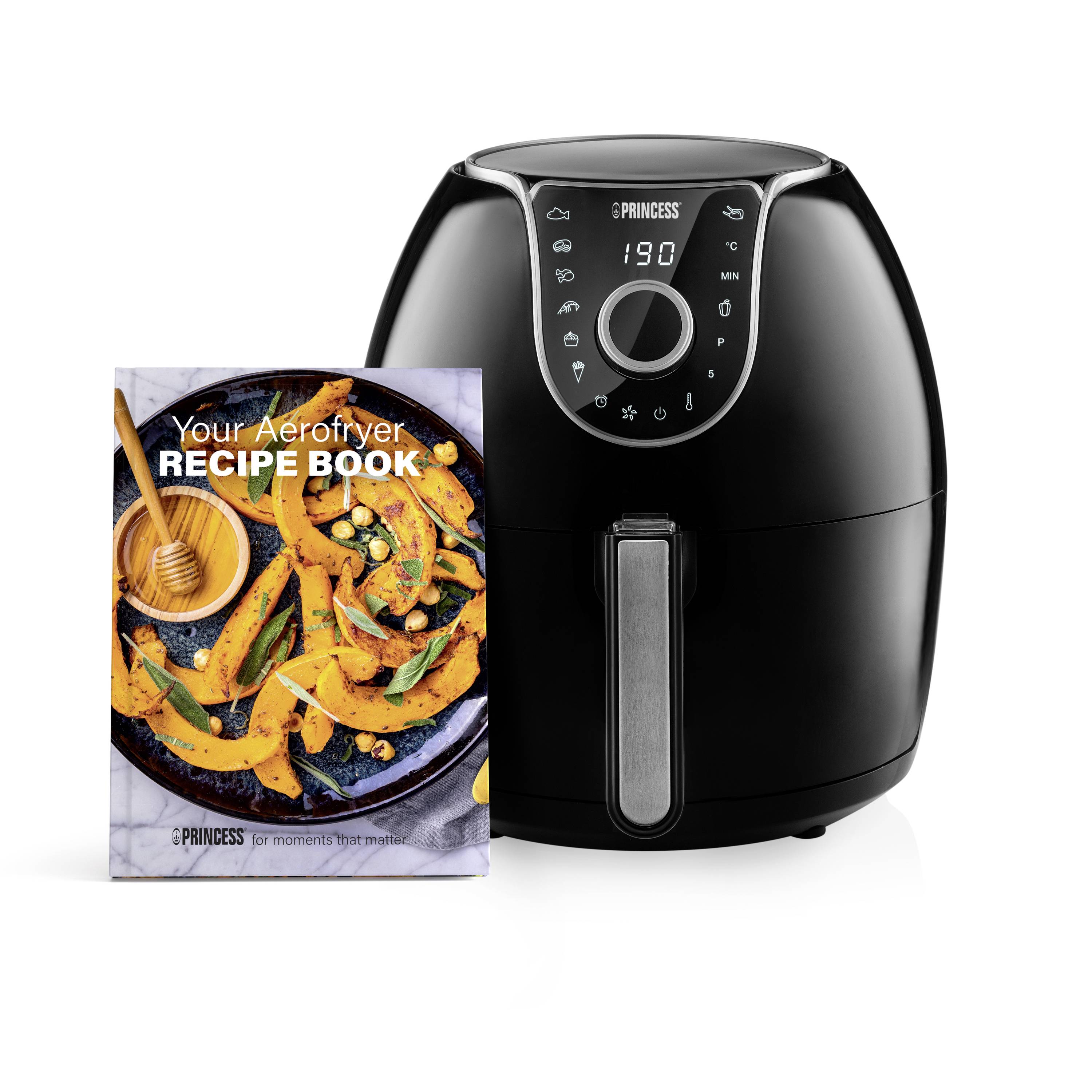 'Princess' hot air fryer with a smooth, black surface next to a recipe book with a pumpkin dish on the cover.