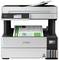 A printer with a document in the top tray and another in the output tray. The display shows various printing options.