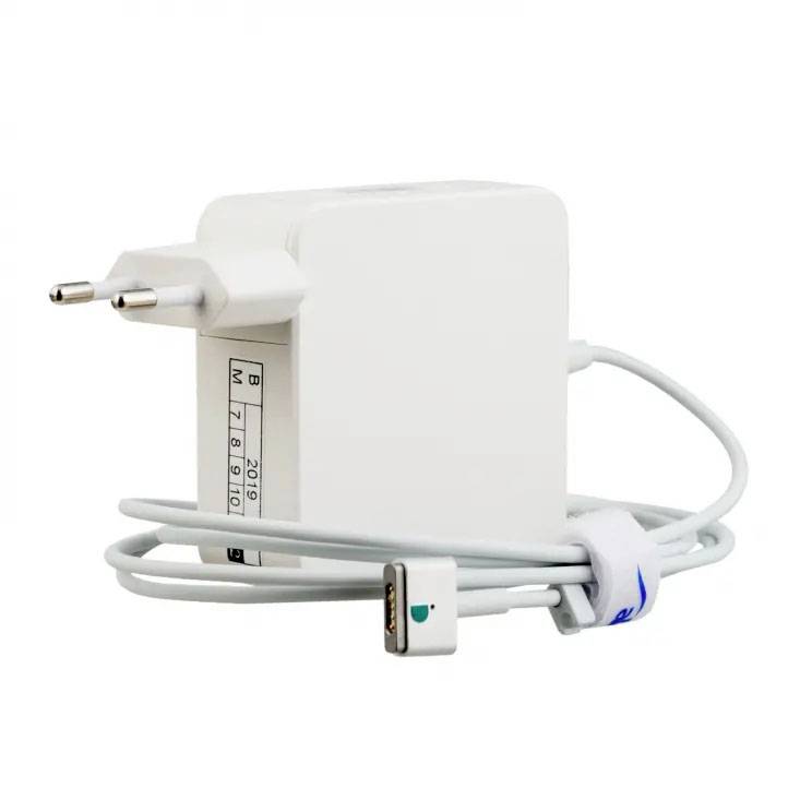 A white wall charger with an EU plug and a connected cable leading to a magnetic connector.
