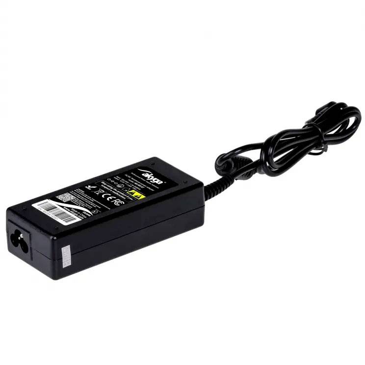 A black laptop power adapter with cable, showing technical specifications on a label.